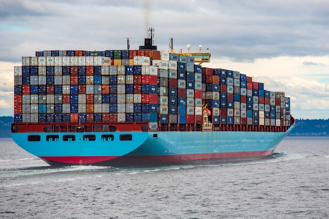 blue-and-red-cargo-ship-on-sea-during-daytime-joqjbvo1p9g